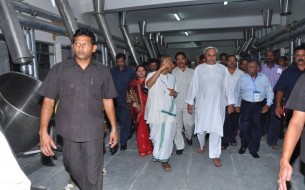 CM Patnaik is taken on a tour of the 3rd centralised kitchen unit in Odisha