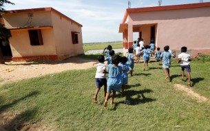 Childrens rushing to school after having Mid Day Meals