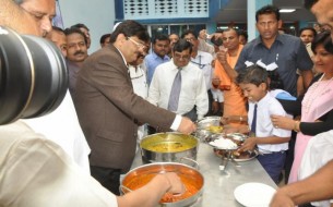 Dignitaries Share In Serving The Mid Day Meal To Happy Students